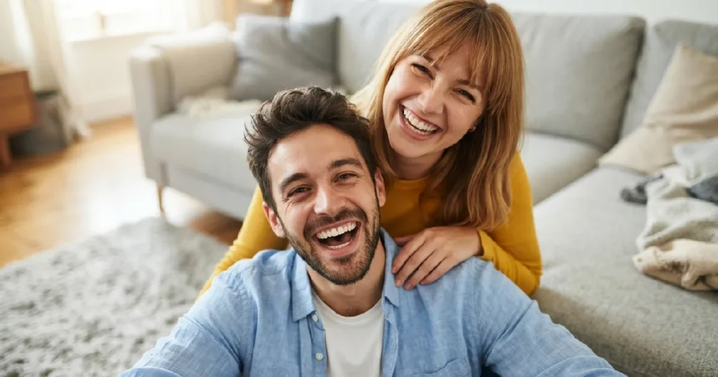 Couple smiling enthusiastically