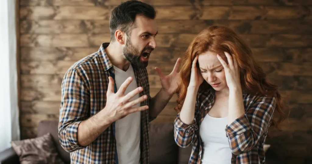Man and woman arguing indoors