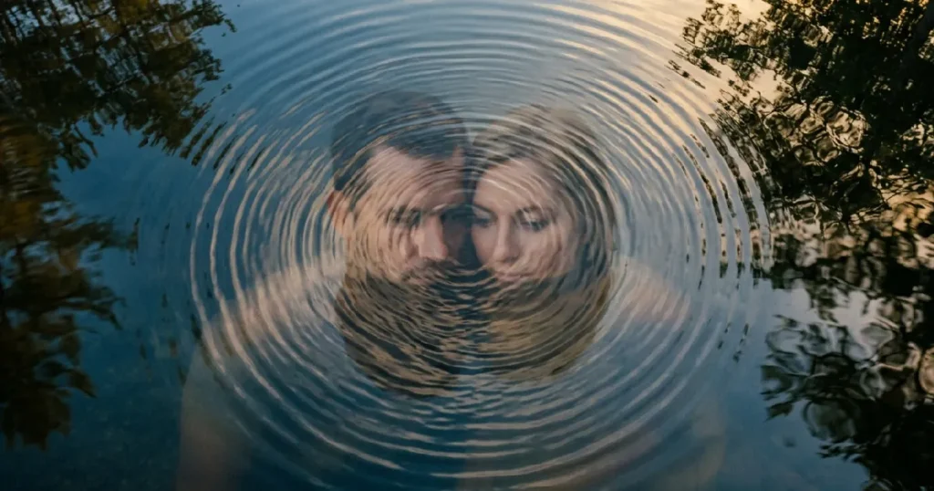 Man and woman reflection water