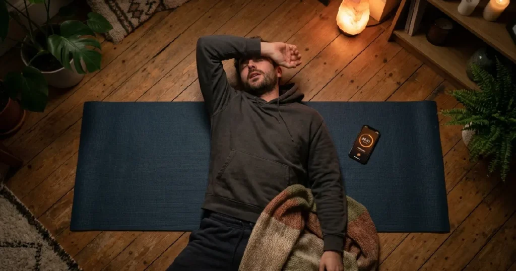 Man asleep on yoga mat